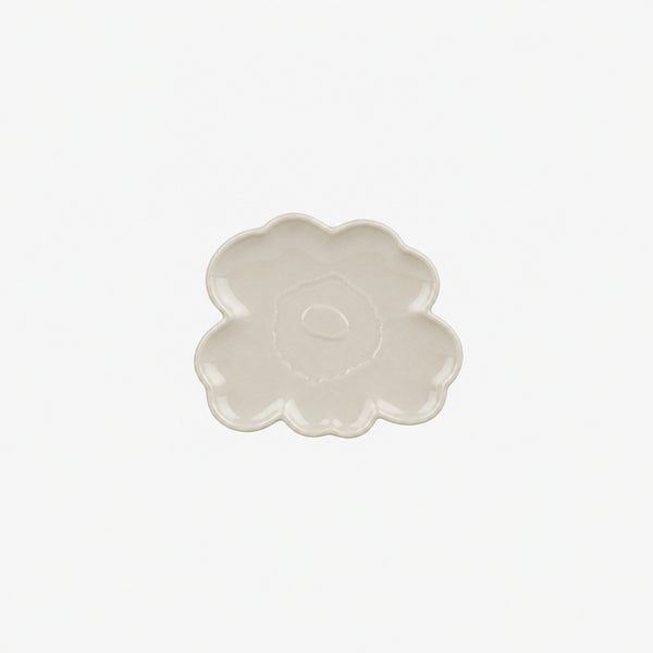 Floral-shaped ceramic dish on a white background