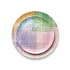 A set of three nested round plates with a colorful pastel grid pattern and a speckled finish, shown on a solid white background.