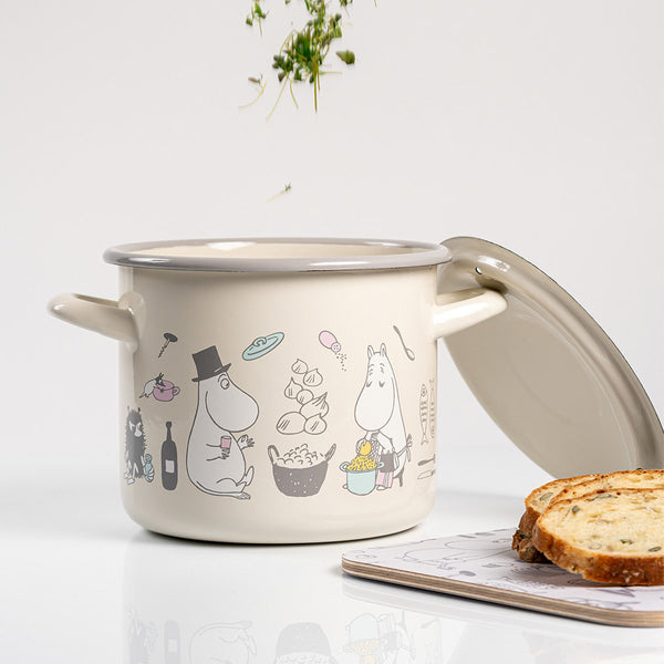 Beige enameled pot with cartoon characters on a white background