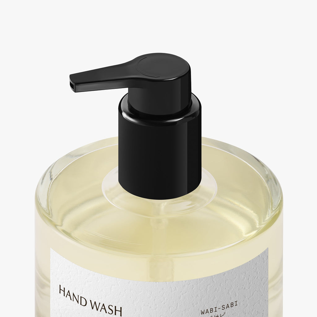 Hand wash bottle with black pump on a white background