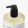 Hand wash bottle with black pump on a white background